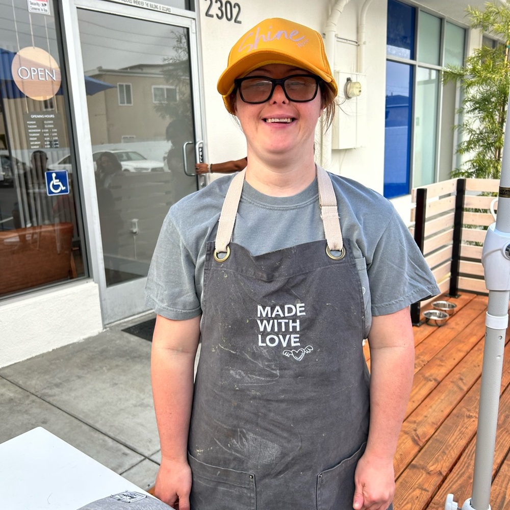Mychal’s print shop made of love shirt and apron also shine hat